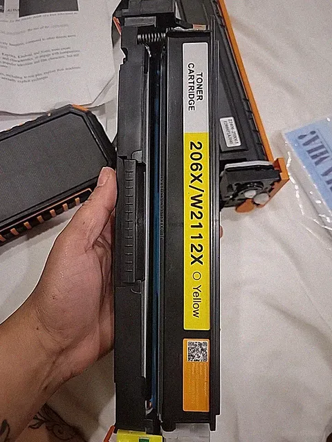 yellow toner cartridge for laser printers, specifically labeled as model...